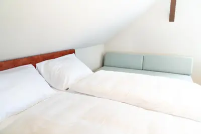 Ein Bett oder Betten in einem Zimmer der Unterkunft Velotique Hotel Angelika - Self-Check-in