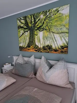 Ein Bett oder Betten in einem Zimmer der Unterkunft Geräumige Ferienwohnung mit eigenem Garten, Klaus