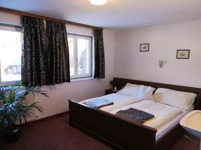 Ein Bett oder Betten in einem Zimmer der Unterkunft Haus Hirschlitten