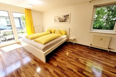 Ein Bett oder Betten in einem Zimmer der Unterkunft Top2 Apartmenthaus Sonnenschein