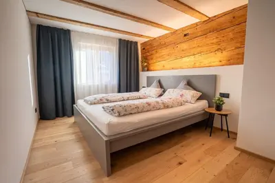 Ein Bett oder Betten in einem Zimmer der Unterkunft Stilvoll sanierte Altbau-Wohnung, Dornbirn Kehlegg