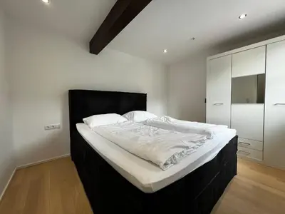 Ein Bett oder Betten in einem Zimmer der Unterkunft Bauern 65
