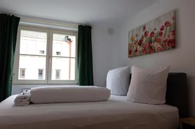 Ein Bett oder Betten in einem Zimmer der Unterkunft Retro-Style in der Bregenzer Fussgängerzone