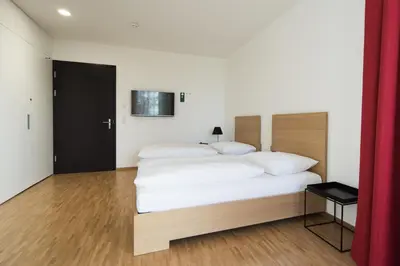 Ein Bett oder Betten in einem Zimmer der Unterkunft Seminar- und Businesshotel Schloss Hofen