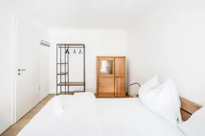 Ein Bett oder Betten in einem Zimmer der Unterkunft Rosengarten Apartments