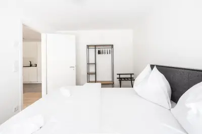 Ein Bett oder Betten in einem Zimmer der Unterkunft Rosengarten Apartments