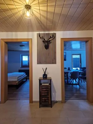 Ein Bett oder Betten in einem Zimmer der Unterkunft Zum schwarzen Hirsch
