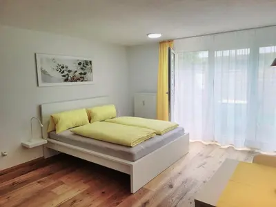 Ein Bett oder Betten in einem Zimmer der Unterkunft Top3 Apartmenthaus Sonnenschein