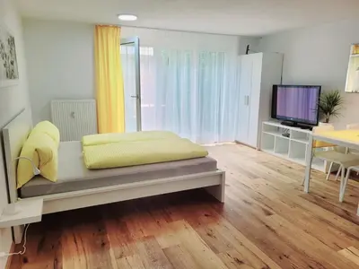 Ein Bett oder Betten in einem Zimmer der Unterkunft Top3 Apartmenthaus Sonnenschein