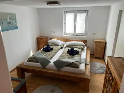 Ein Bett oder Betten in einem Zimmer der Unterkunft Gästehaus Aigner