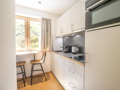 Küche/Küchenzeile in der Unterkunft Appartements Basecamp Warth