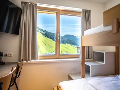 Ein Bett oder Betten in einem Zimmer der Unterkunft Appartements Basecamp Warth