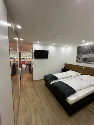 Ein Bett oder Betten in einem Zimmer der Unterkunft FeWo 236 Aparthotel Mittelberg