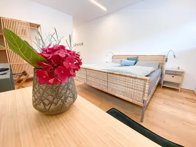 Ein Bett oder Betten in einem Zimmer der Unterkunft Neueröffnung! Gästezimmer im Herzen von Lauterach