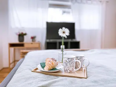Ein Bett oder Betten in einem Zimmer der Unterkunft Neueröffnung! Gästezimmer im Herzen von Lauterach