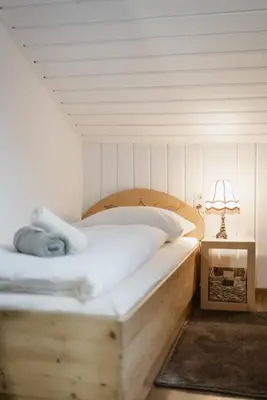 Ein Bett oder Betten in einem Zimmer der Unterkunft Haus Erlenau