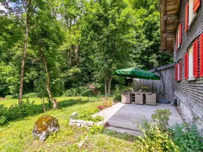 Ein Garten an der Unterkunft Waldhüsle
