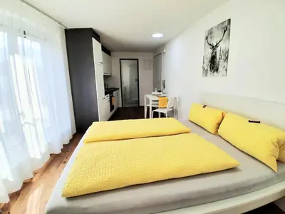 Ein Bett oder Betten in einem Zimmer der Unterkunft Top12 Apartmenthaus Sonnenschein