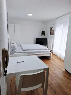 Ein Bett oder Betten in einem Zimmer der Unterkunft Top12 Apartmenthaus Sonnenschein