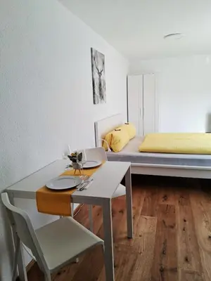 Ein Bett oder Betten in einem Zimmer der Unterkunft Top12 Apartmenthaus Sonnenschein