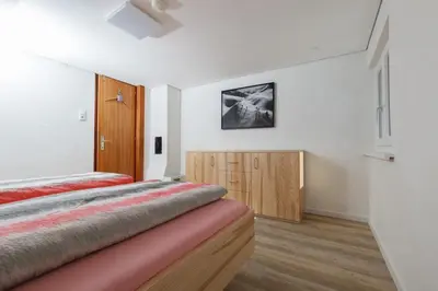 Ein Bett oder Betten in einem Zimmer der Unterkunft Ferienhaus Waldklause