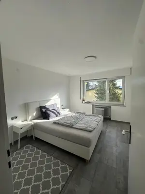 Ein Bett oder Betten in einem Zimmer der Unterkunft Schöne Wohnung in Top Lage
