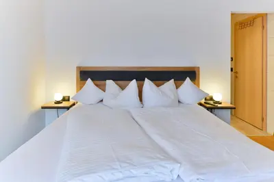 Ein Bett oder Betten in einem Zimmer der Unterkunft Haus Margrith Alpenblick Appartements