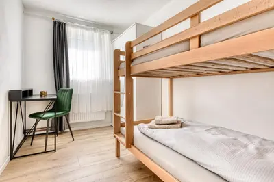 Ein Bett oder Betten in einem Zimmer der Unterkunft Gartenferienwohnung Arlberg