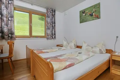 Ein Bett oder Betten in einem Zimmer der Unterkunft Ferienhof Feurle