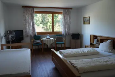 Ein Bett oder Betten in einem Zimmer der Unterkunft Pension Tsingdao