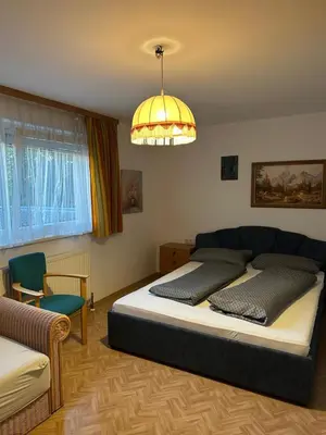 Ein Bett oder Betten in einem Zimmer der Unterkunft Pension Tsingdao