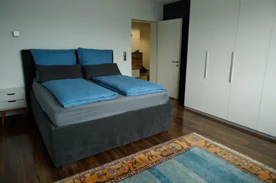 Ein Bett oder Betten in einem Zimmer der Unterkunft Ferienwohnung in Dornbirn