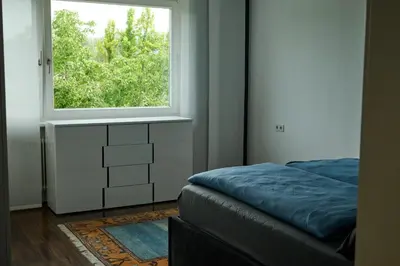Ein Bett oder Betten in einem Zimmer der Unterkunft Ferienwohnung in Dornbirn