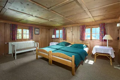 Ein Bett oder Betten in einem Zimmer der Unterkunft Chalet Alte Mühle