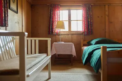 Ein Bett oder Betten in einem Zimmer der Unterkunft Chalet Alte Mühle