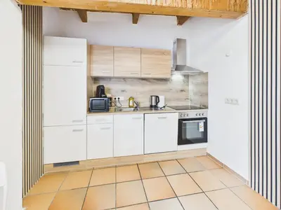 Küche/Küchenzeile in der Unterkunft CROWN LIVING Babylon Studios Lustenau - Studios nahe Messe und Schweizer Grenze, WLAN, kostenloser Parkplatz, Self Check-in, ideal für Geschäftsreisende und Feriengäste