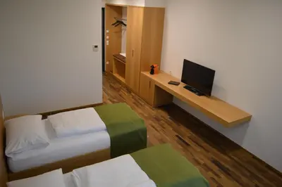 Ein Bett oder Betten in einem Zimmer der Unterkunft Business Motel Feldkirch