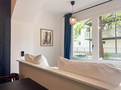 Ein Bett oder Betten in einem Zimmer der Unterkunft Apartment kleines Schiller