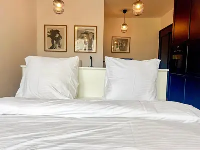 Ein Bett oder Betten in einem Zimmer der Unterkunft Apartment kleines Schiller
