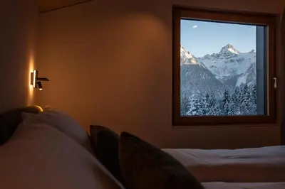 Ein Bett oder Betten in einem Zimmer der Unterkunft Modernes Architektur-Chalet mit Alpenpanorama