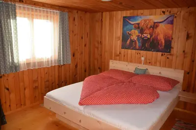 Ein Bett oder Betten in einem Zimmer der Unterkunft Ferienhaus Fritzensee