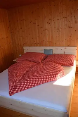 Ein Bett oder Betten in einem Zimmer der Unterkunft Ferienhaus Fritzensee