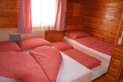 Ein Bett oder Betten in einem Zimmer der Unterkunft Ferienhaus Fritzensee
