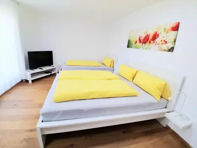 Ein Bett oder Betten in einem Zimmer der Unterkunft Top18 Apartmenthaus Sonnenschein