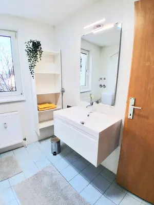 Ein Bett oder Betten in einem Zimmer der Unterkunft Top18 Apartmenthaus Sonnenschein