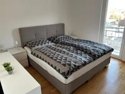 Ein Bett oder Betten in einem Zimmer der Unterkunft Helle, gemütliche 2-Zimmerwohnung in Feldkirch