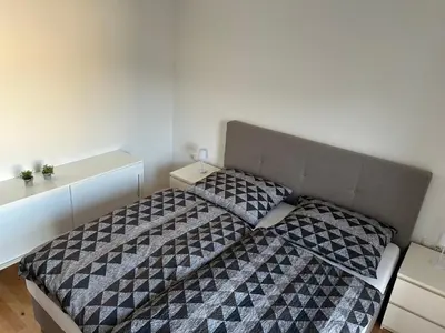 Ein Bett oder Betten in einem Zimmer der Unterkunft Helle, gemütliche 2-Zimmerwohnung in Feldkirch