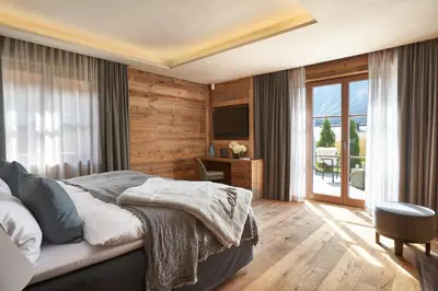 Ein Bett oder Betten in einem Zimmer der Unterkunft Chalet Alpha LUXURY Spa