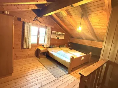Ein Bett oder Betten in einem Zimmer der Unterkunft Ferienwohnungen im Blockhaus Metzler