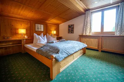 Ein Bett oder Betten in einem Zimmer der Unterkunft die AlpenRose